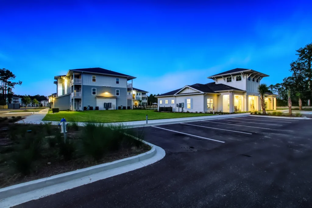 Parking lot and back side of the Exchange at Orange Park, a garden apartment development in Jacksonville, Florida.