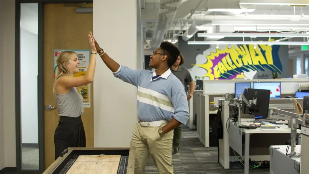 Photo of Galloway interns giving each other a high five.