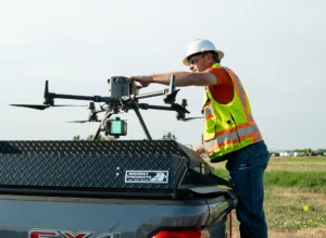 A Galloway survey team member prepare a drone for flight.